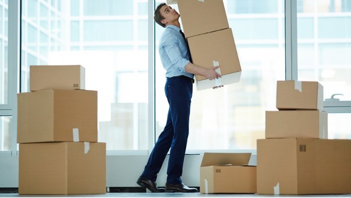 Mover carrying stacked cartons indoors